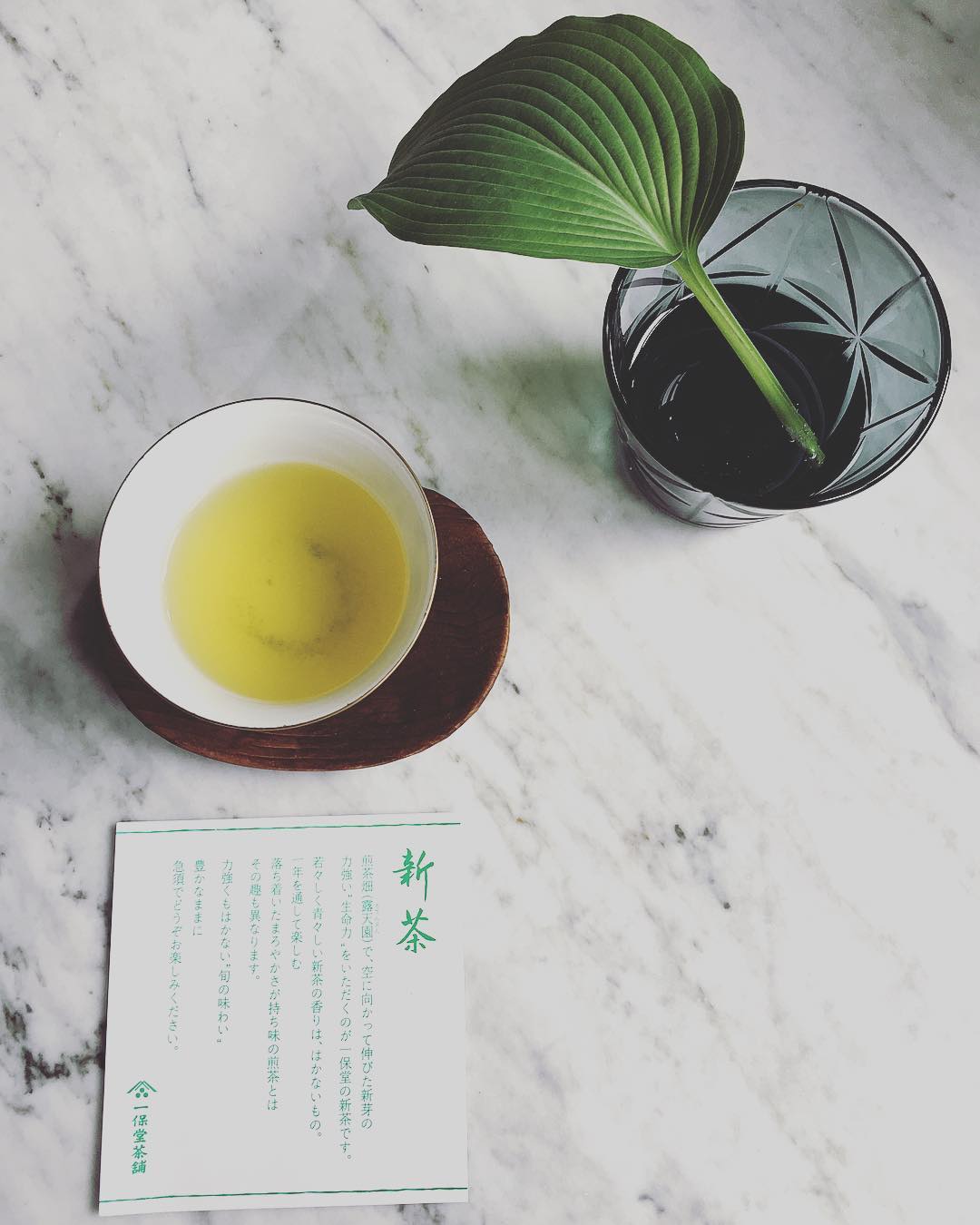 cup of japanese green tea on marble surface