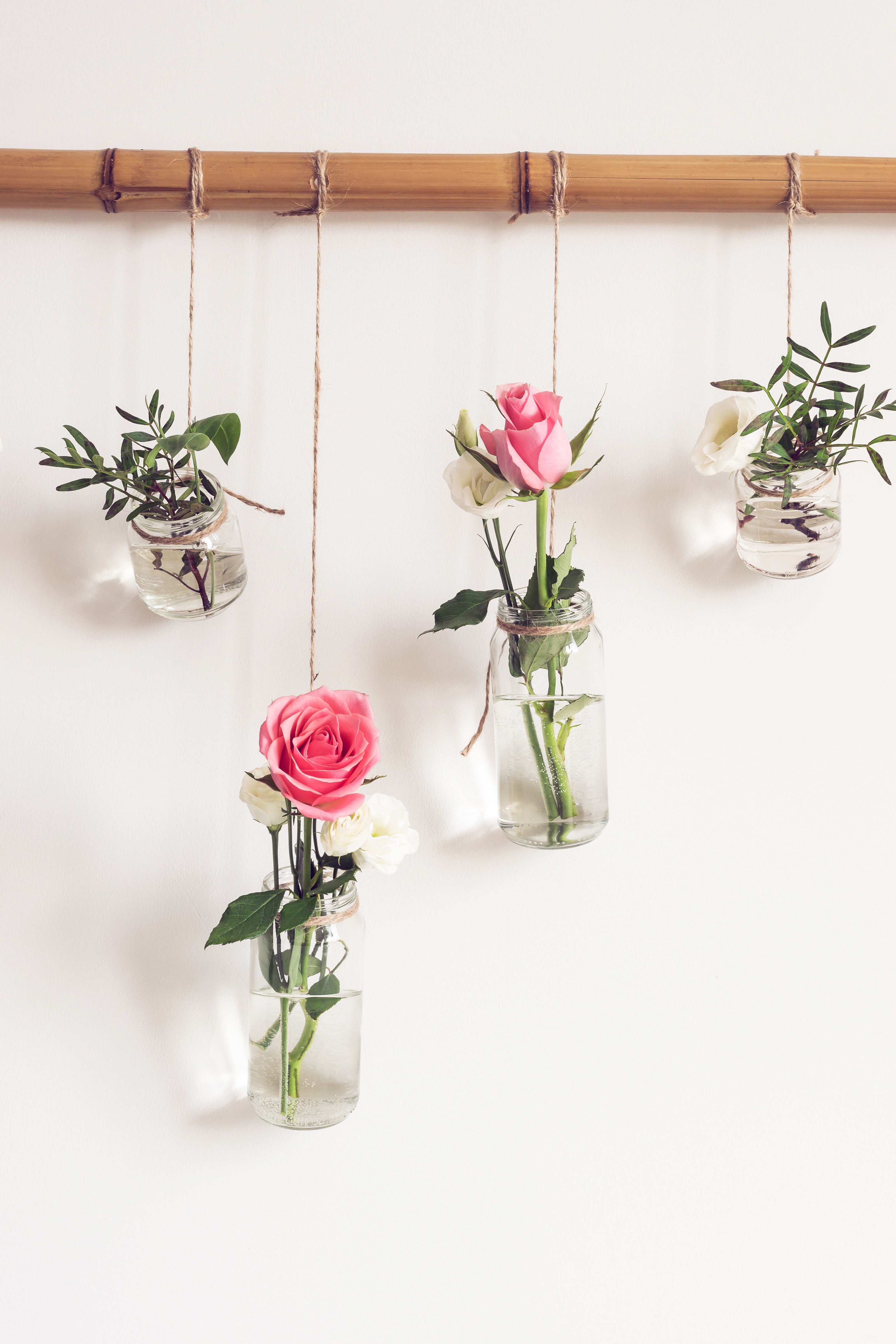 Glass jars are reused as hanging vases