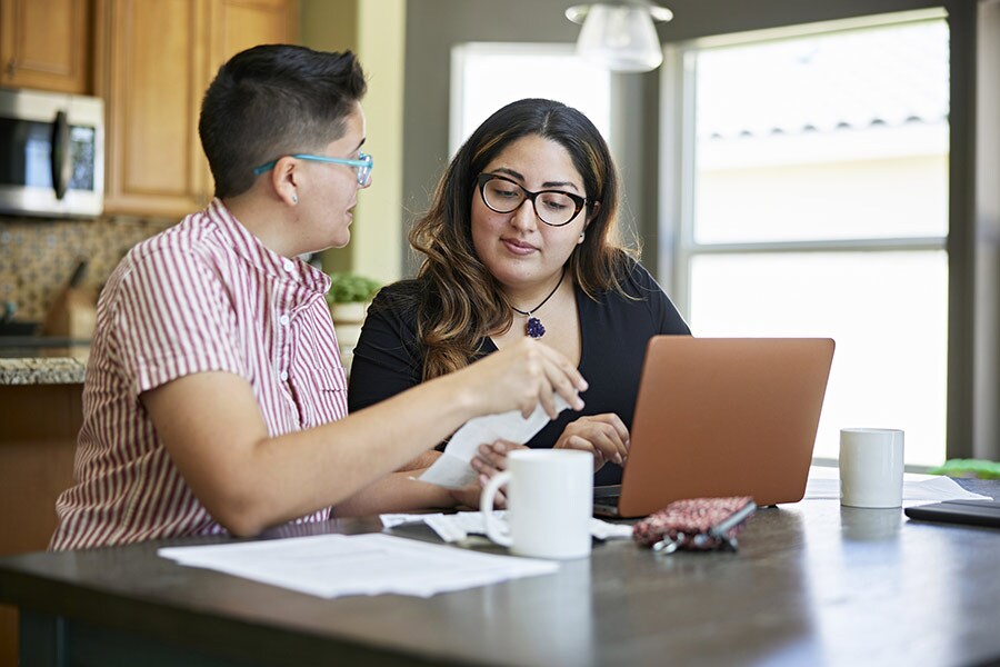 A couple reviews their finances at home