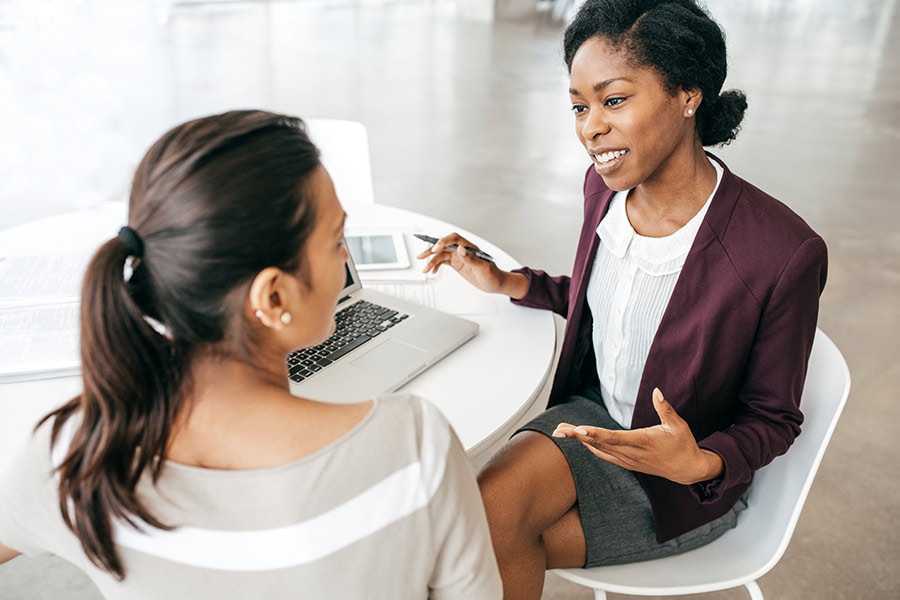 A customer meets with a financial planner to review her investments