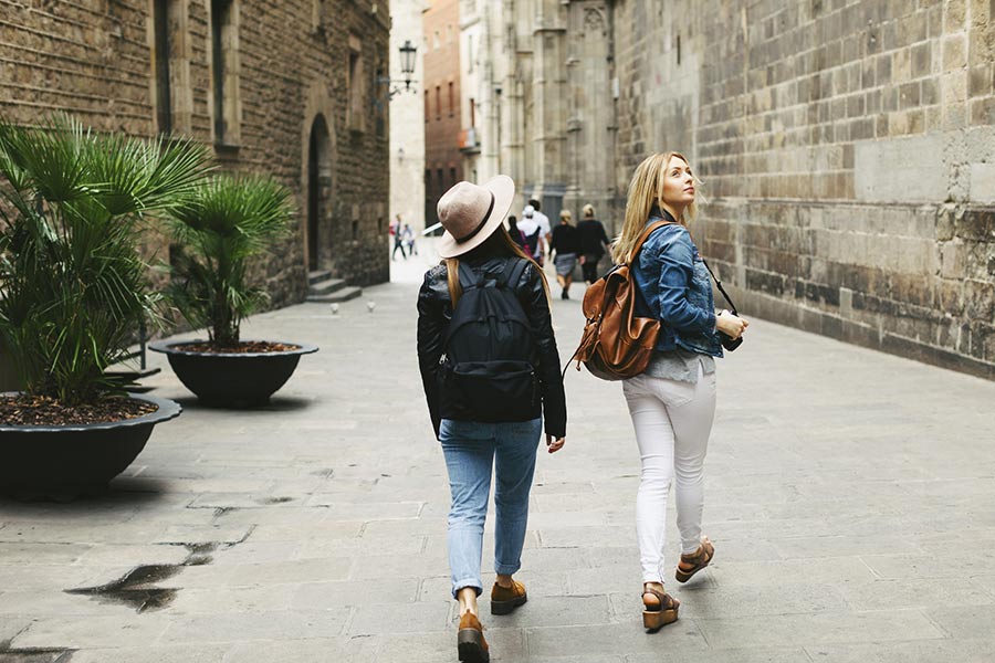 Two woman explore the streets of Barcelona