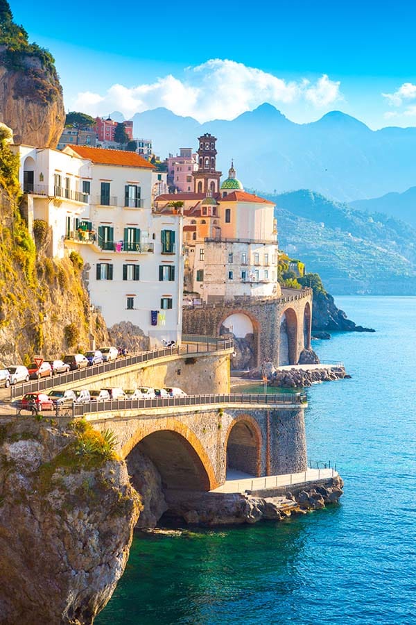 Beautiful buildings built into a cliffside over looking water