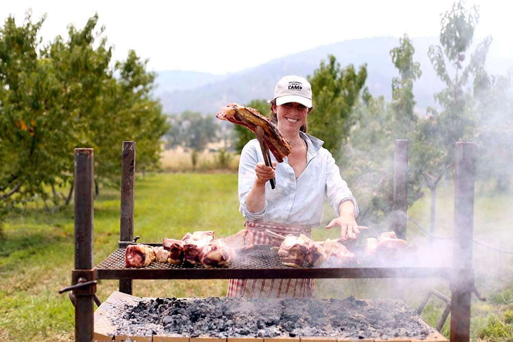 woman grilling meat