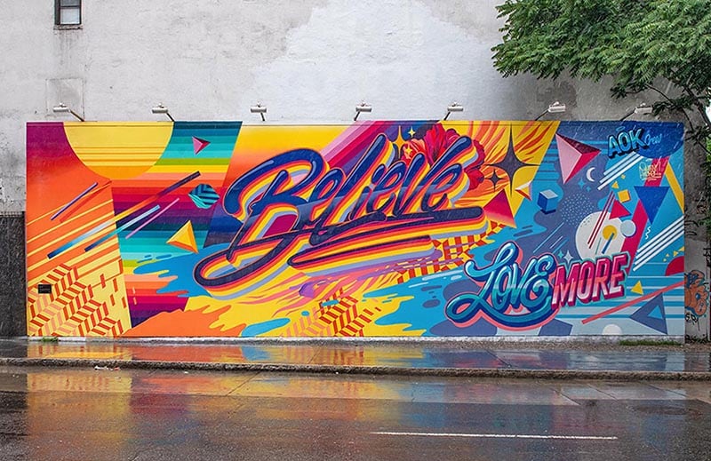 Mural on a wall that depicts the word Believe